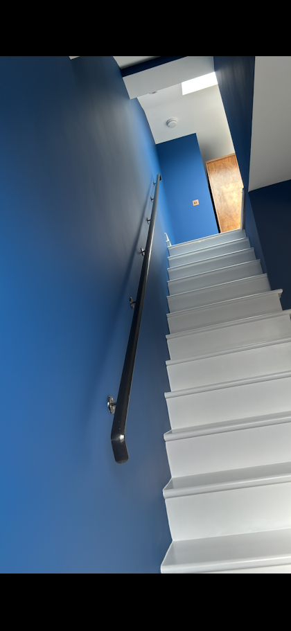 Deep blue accent wall on a staircase
