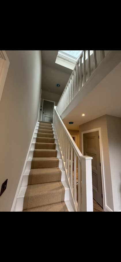 Bright white traditional staircase